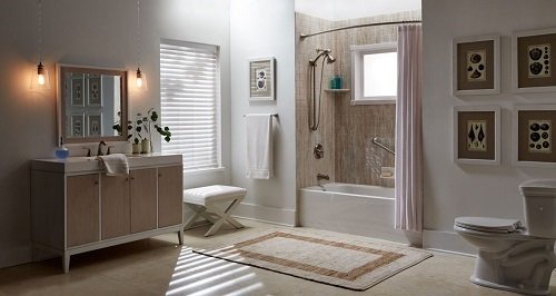 White bathroom with large vanity and traditional tub and shower combo.